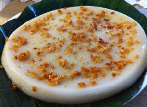 Kalamay sunsong with latik or cooked coconut oil as topings